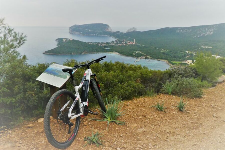 Alghero: Small Beaches E-Bike Tour with Aperitivo - The WWII military settlement adds real substance