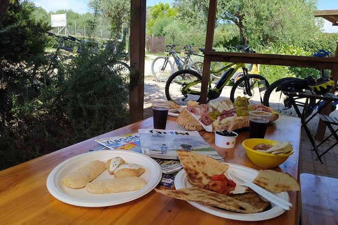 Alghero - Small Beaches Tour by E-bike more aperitif - Starting in Alghero’s old town area
