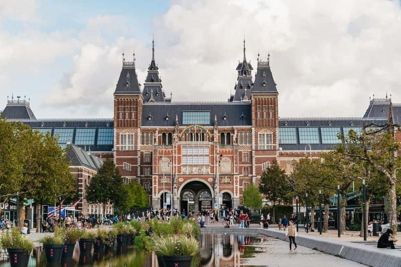 Amsterdam Bike Tour in Small Group + Optional Canal Cruise - Centraal Station, Artis Zoo, and De Gooyer Windmill