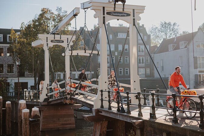 Amsterdam City Top Highlights Guided Bike Tour - Small streets, cafes, and the oldest quarter