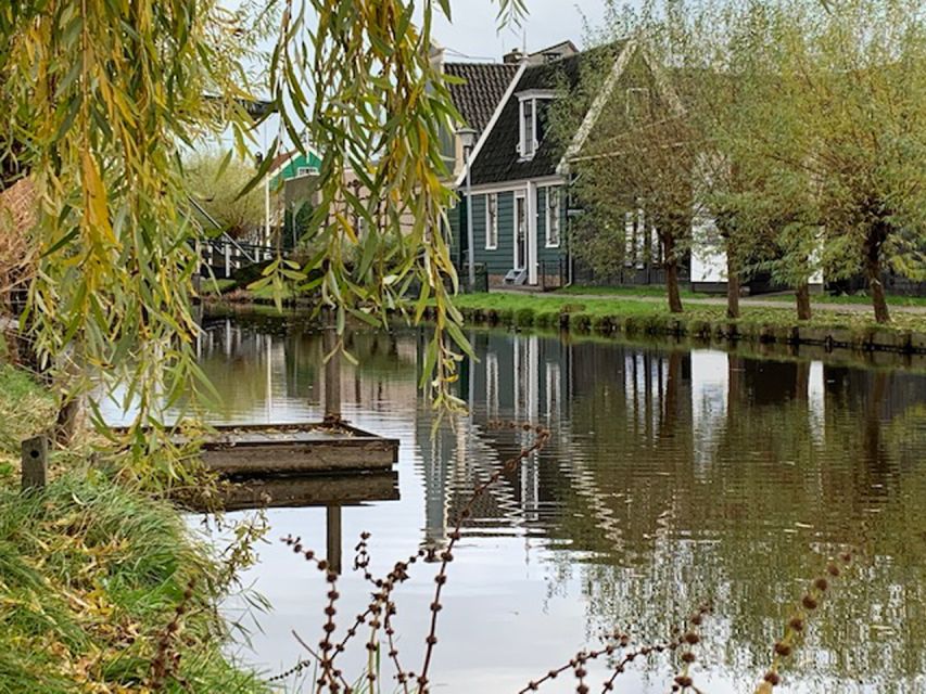 Amsterdam: Countryside Bike Tour and Zaanse Schans Windmills - Industrial windmills before the crowds