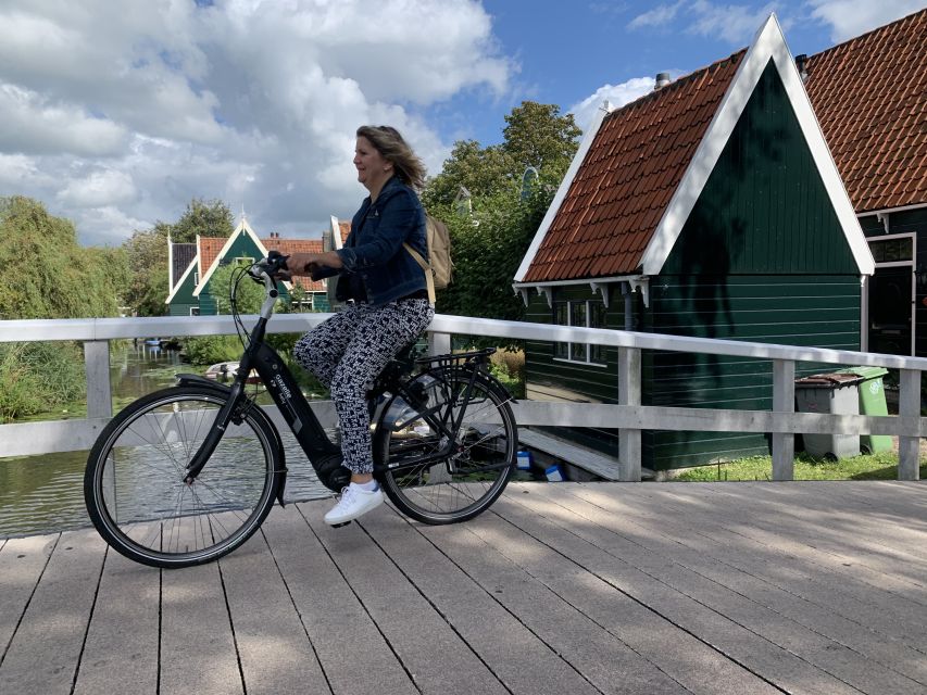 Amsterdam: Countryside Bike Tour and Zaanse Schans Windmills - Pedaling through wetlands painted by Monet