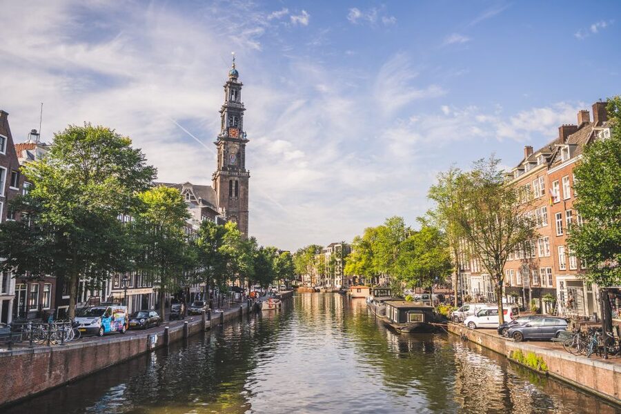 Amsterdam full day tour: Walking, Biking & Cruising - Cycling from the station to De Gooyer and Artis