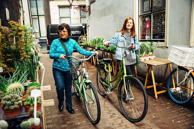 Amsterdam PRIVATE Bike Tour With Locals: Bike & Local Snack Included - Magere Brug and the Amstel crossing