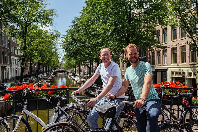 Amsterdam PRIVATE Bike Tour With Locals: Bike & Local Snack Included - Jordaan lanes, canals, markets, and local stops