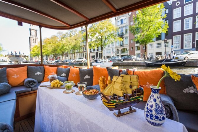 Amsterdam Small-Group Bike Tour With Canal Cruise, Drinks, Cheese - The canal cruise, cheese, drinks, and changing plans