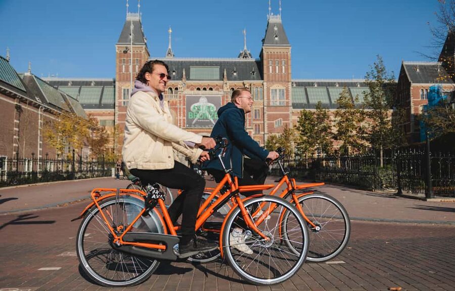 Amsterdam: Top Highlights Guided Bike Tour - What the guides add to the ride