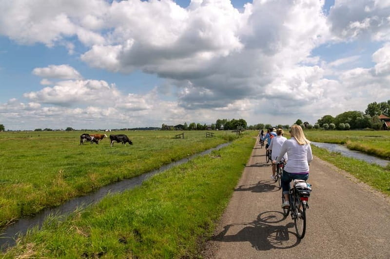Amsterdam: Windmill, Cheese, and Countryside E-Bike Tour - Leaving Amsterdam by ferry and bicycle