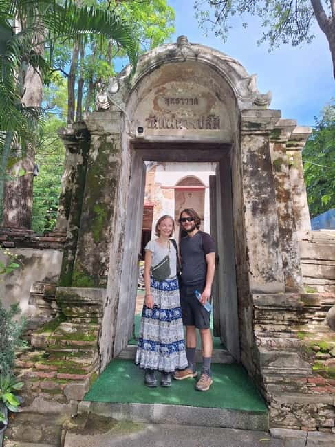 Ayutthaya: Colorful Slow Life Bicycle Tour with local guide. - Wat Mahathat and the Buddha in the roots