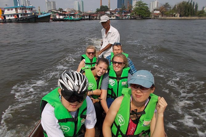 Bangkok Green Oasis 4-Hour Bike Tour with Boat Ride - Leaving Bangkok at Wat Khlong Toei Nok Pier