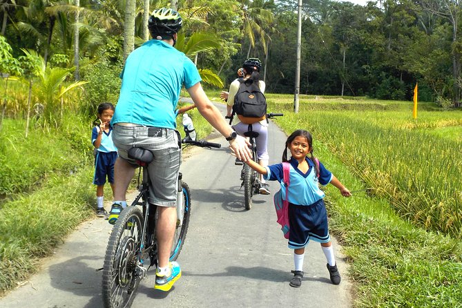 Electric Cycling Tour of Ubud with Free Hotel Transfer and Lunch - Riding through Ubud’s traffic and villages