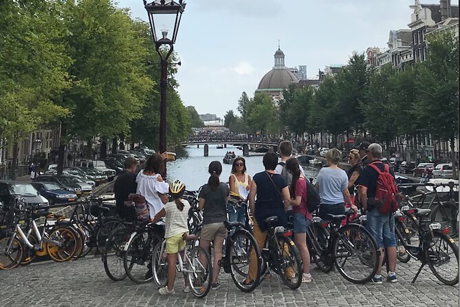 Explore Amsterdam by Bike in the Company of a French Local Guide - Begijnhof, Entrepotdok, and the western canal belt