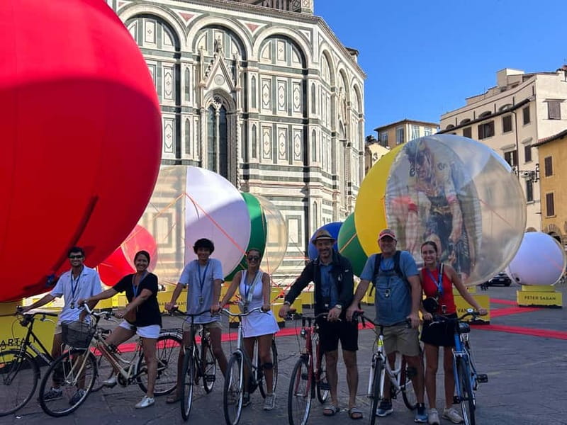 Florence: Untold Small Group Bike Tour - Piazza della Signoria and the wine-window pause