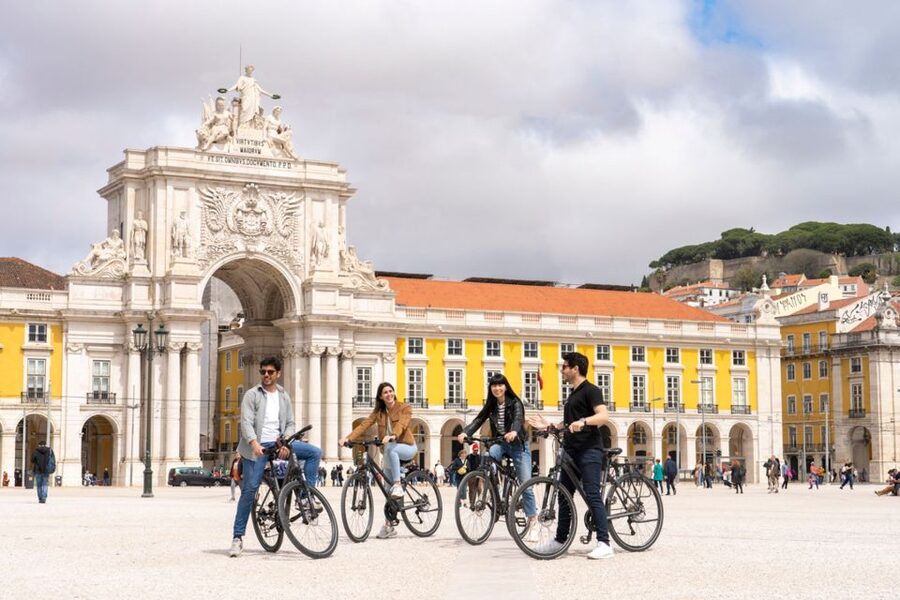 Lisbon: Guided Bike Tour, Helicopter Flight, and Boat Trip - Starting in Rossio and walking through old Lisbon