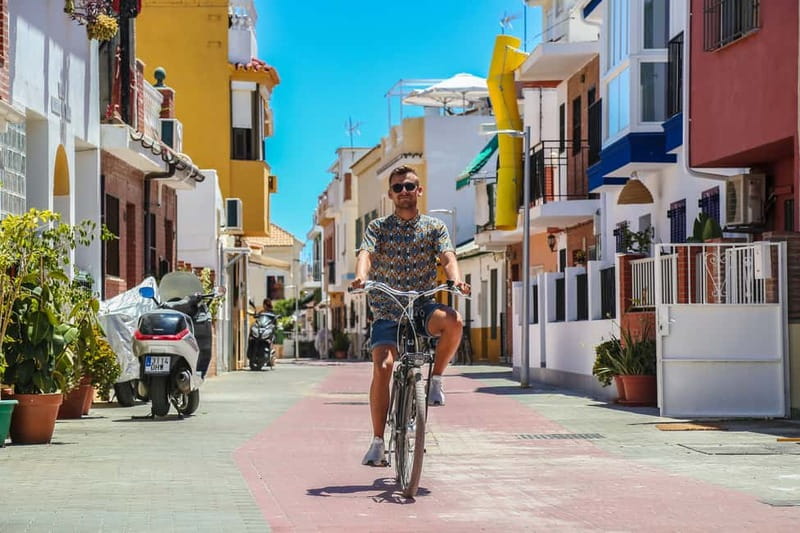 Malaga: Castle Hill and Fisherman Village E-Bike Tour - Key points at a glance