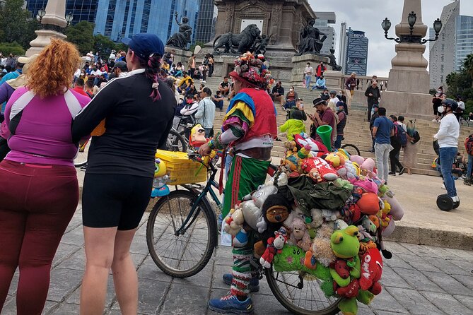 Mexico City E-Bike Tour with a taco and churros stop - El Ángel and the city’s patriotic symbol