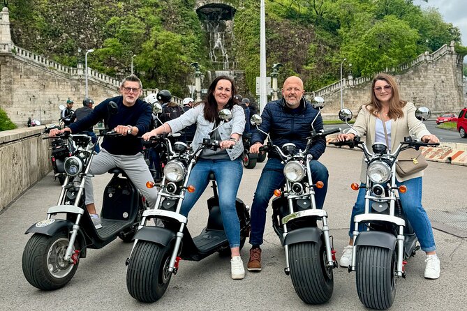 Monster Bike Sightseeing Tour – City Budapest on Electric Rollers - Shoes on the Danube Bank and the Hungarian Parliament