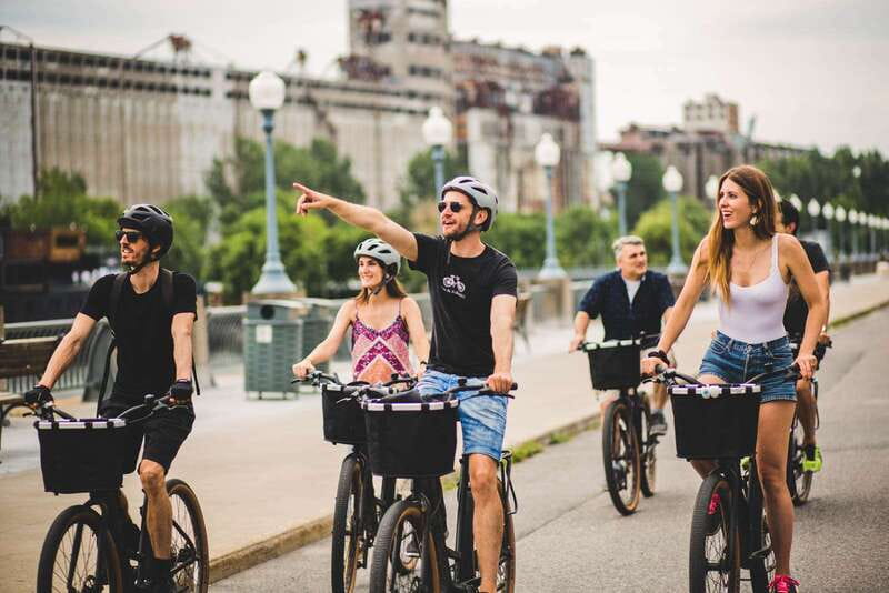 Montreal: Downtown and Old Montreal Highlights Bike Tour - Place d’Armes and Notre Dame Basilica