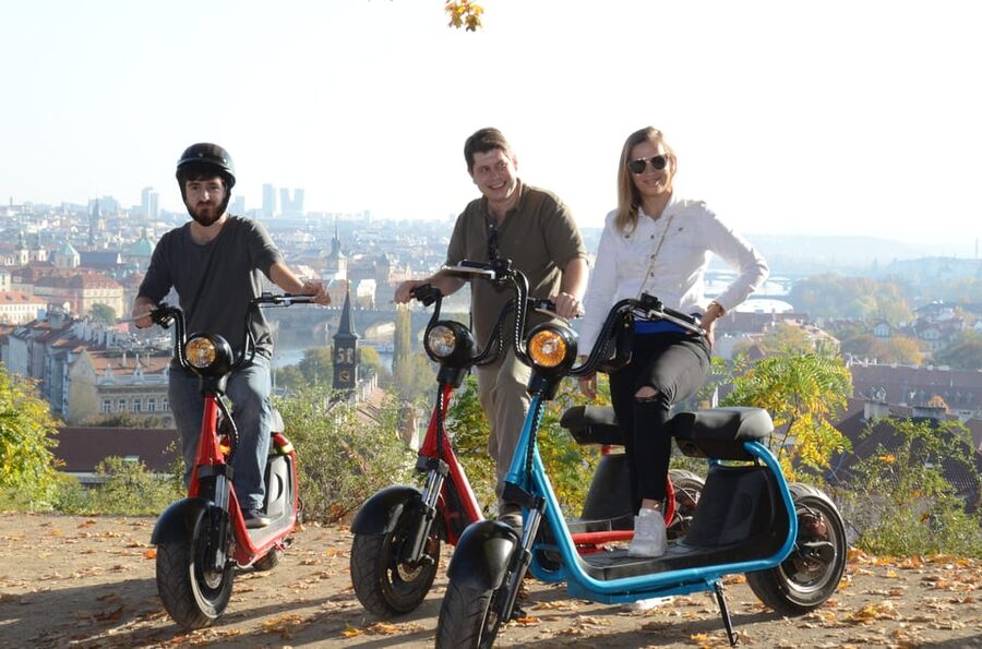 Prague Electric Scooter and eBike Grand Tour - Charles Bridge, the National Theatre, and the River