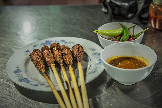 Private Hoi An Evening Food Tastings Tour by Bike - Hoi An after dark: grilled food by the river