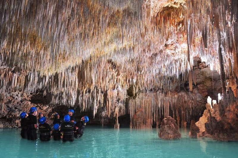Rio Secreto Nature Reserve: Bicycle, Rappel & Ziplines Tour - Walking through the underground river