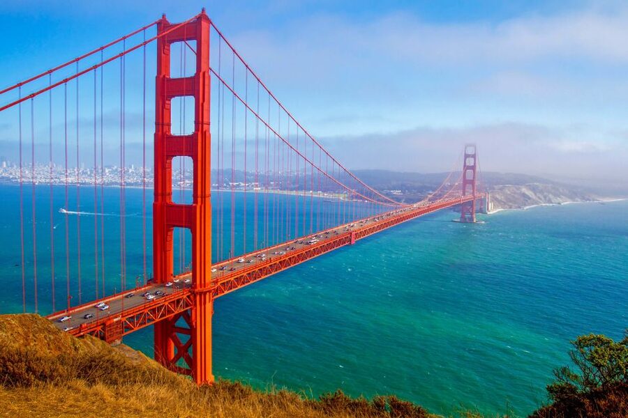 San Francisco: Exclusive Bike, Beer, and Boat Tour - Riding through the Presidio toward the bridge