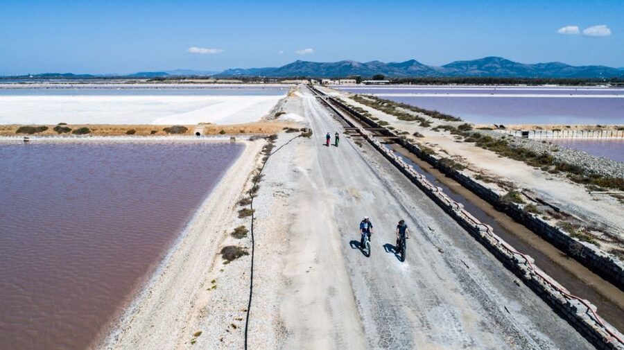 Sant'Antioco: Guided E-Bike Excursion at Sunset - Salt mountains, pans, and the work behind the view