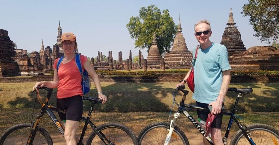 Sukhothai: Full-Day Historical Park Cycling Tour with Lunch - Entering Sukhothai Historical Park by bicycle