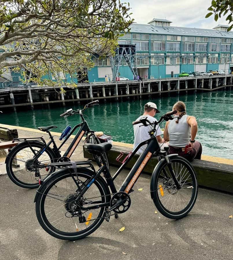 Sydney: Electric Bike Rental & Wheel Explorer Audio Guide - Crossing toward the Harbour Bridge and Circular Quay
