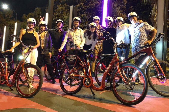 The City Lights: a unique electric bike tour of Auckland by night! - Riding the pink Lightpath after dark
