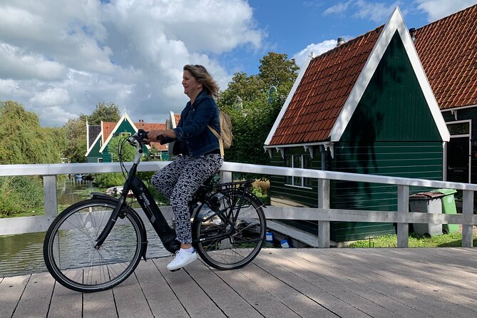 Visit Amsterdam Countryside with windmills by bike - Cycling Through Wet Meadows and Along the Dikes