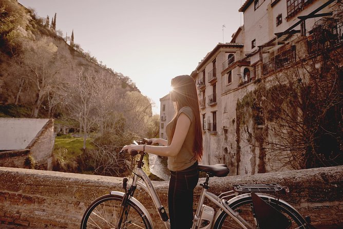 Zooming Through Granada: A Fun-Filled Electric Bike Tour - The climb toward Sacromonte Abbey